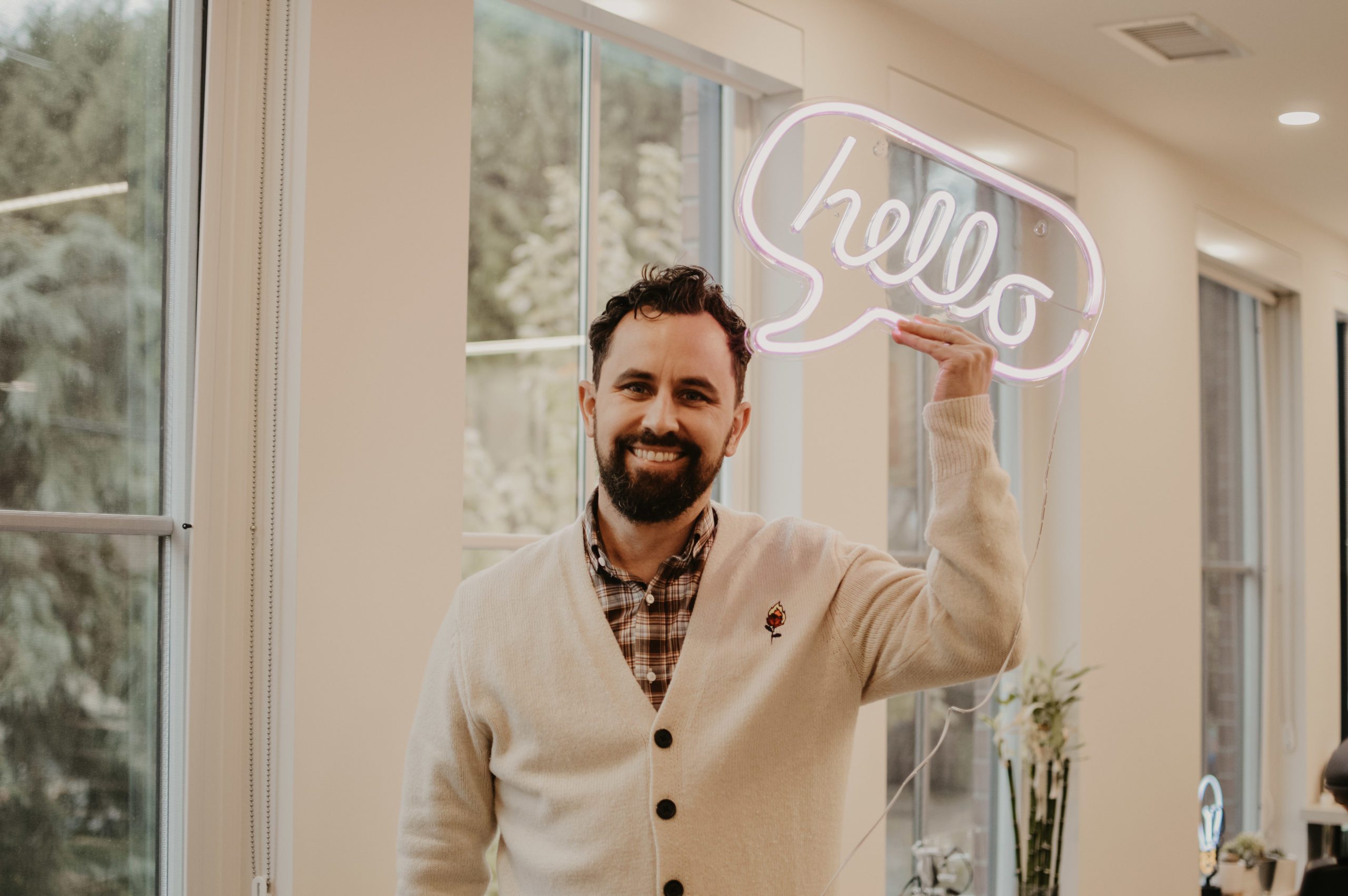 Darian Kovacs Holding Hello Sign - Jelly Marketing Founding Partner